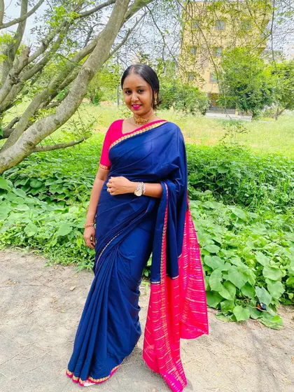 Enjoying a moment outdoors. I love the combination of this royal blue and pink Mysore silk saree.