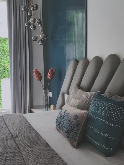 A peek into the master bedroom, which is located next to the courtyard to enjoy relaxing views of the vertical garden. The room is flooded with natural light, creating a bright and airy sanctuary.