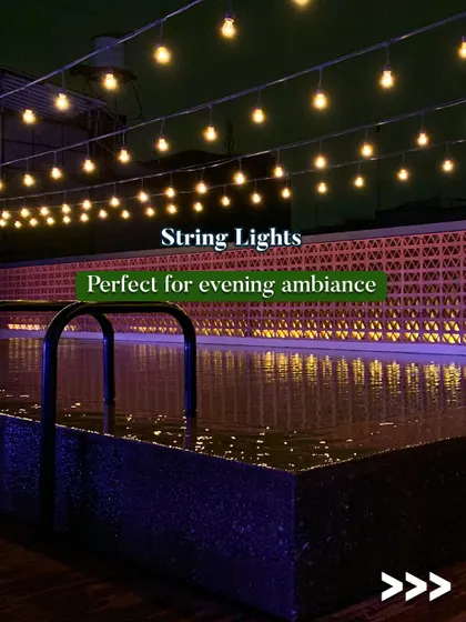 String lights are perfect for creating evening ambiance around the pool. This image shows how they can be used to add a warm, magical glow to your poolside area after dark.