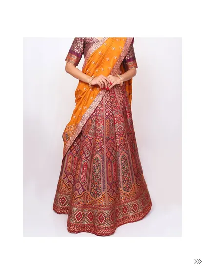 The full view of the traditional brocade lehenga, showcasing its regal flair and timeless appeal. A classic choice for any grand celebration.