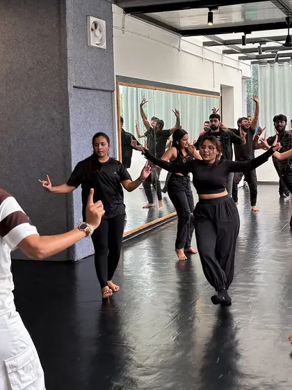 Guiding my students through a hip-hop bhangra routine. My workshops are hands-on, and I make sure everyone gets the steps right.