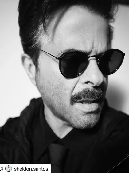 A powerful black and white portrait of Anil Kapoor. A strong haircut is essential for creating such a dramatic and impactful image.