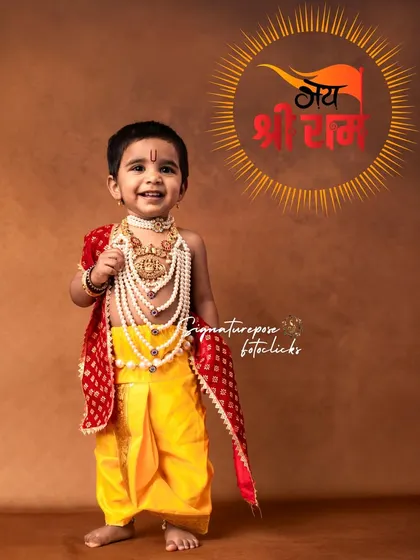 A joyful little boy dressed as Baalarama, with a "Jai Shri Ram" graphic adding a celebratory touch to the portrait.