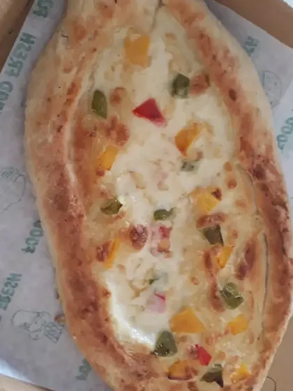 My vegan version of Khachapuri, a Georgian cheese bread. It's filled with a newly developed creamy vegan cheese sauce and bell peppers.