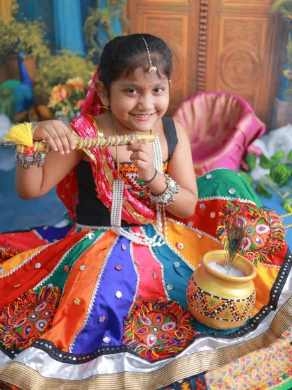 This little Gopi is ready to play the bansuri. I love capturing the confidence and charm of older siblings during these themed shoots.