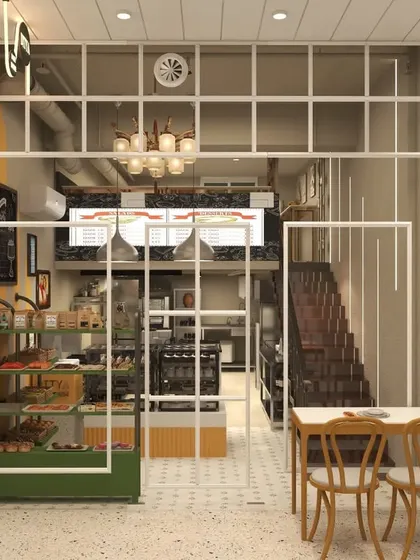 The storefront of the bakery is designed with a large glass facade, creating a window-shopping effect that invites passersby. The interior is visible, showcasing the warm and lively atmosphere inside.