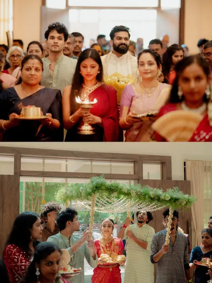 The bride's procession, led by family members carrying lamps and offerings. A serene and beautiful tradition from a South Indian wedding.