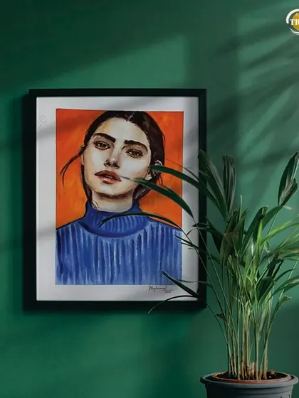 A watercolor portrait with a striking orange and blue color combination, shown here framed and hung. This piece has been sold, but it's a great example of the kind of bold, contemporary portraiture I love to create.