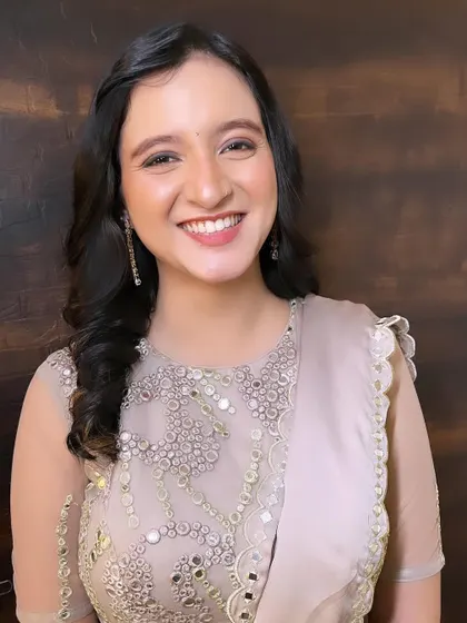 A soft and elegant look for a special day. The makeup is minimal yet polished, with a focus on enhancing her natural features.