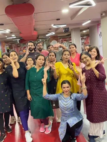 The whole class, including men and women, posing after the Ganesh Chaturthi session. My classes are inclusive and welcoming to everyone in the family.