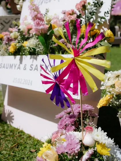 Playful and colorful pinwheels used as part of the floral decor for a fun and whimsical 'Pastel Mela' Mehendi.
