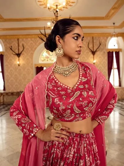 A close-up shot focusing on the rich details of the bridal lehenga and jewelry. The model's pose exudes confidence and grace, perfect for a bridal campaign.