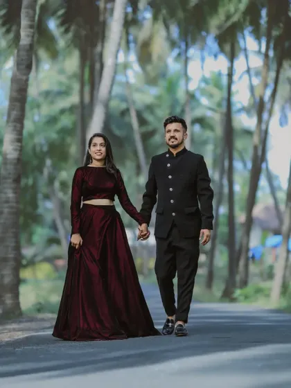 A classic walking shot from a pre-wedding session. The coordinated outfits and the backdrop of palm trees give this a very elegant and planned feel.