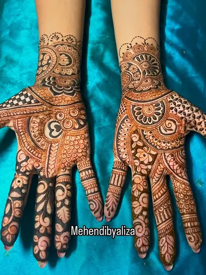 Another view of the modern geometric design, showing how the patterns are mirrored yet unique on each hand.