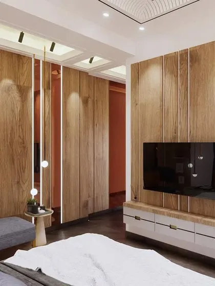 This view of the guest bedroom showcases the TV unit and the interplay of different materials. The wooden panels and mirrored strips create a dynamic and modern look.