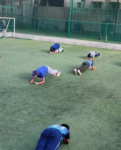 Core strength is the foundation of a powerful athlete. Our U-14 team works on planks and other core exercises, building stability and endurance.