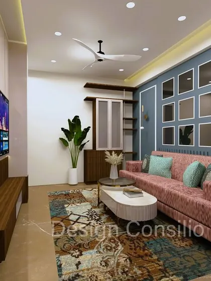 This wide shot shows how all the elements in the living room come together. The patterned rug, the colorful sofa, and the textured accent wall create a space that is full of personality.