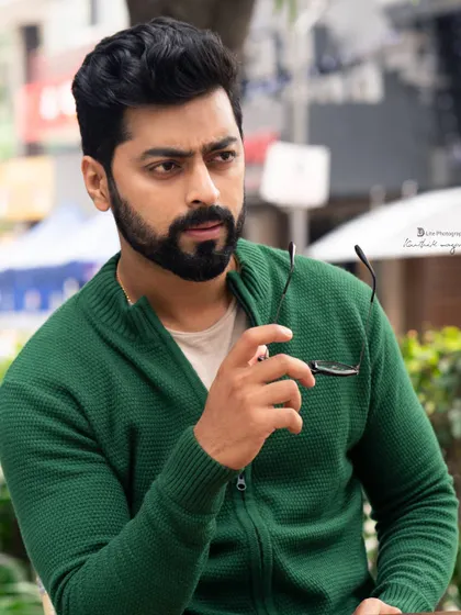 A thoughtful, candid-style portrait of Tarak Ponnappa. This kind of shot is essential for an actor's portfolio to show a more natural and approachable side.