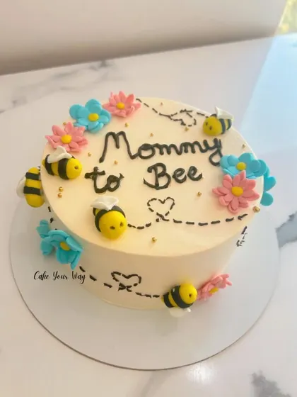 A little honey is on the way. A sweet "Mommy to Bee" cake, perfect for a baby shower.