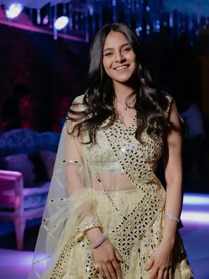 The sister of the bride looking gorgeous for the Sangeet. A fun, youthful makeup look with glowing skin.