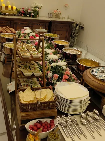 Another angle of the floral-themed buffet, showing the long line of delicious options available for guests. I work to make my buffets look like a garden of culinary delights.