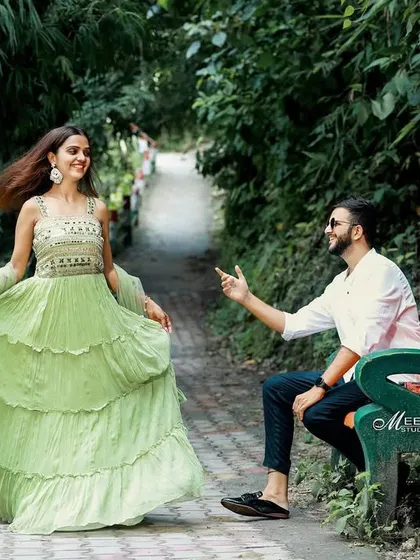 A fun, interactive moment on a park bench during a pre-wedding shoot. Capturing these candid, playful interactions is what brings a photo story to life.