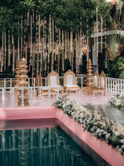 The beautifully decorated mandap by the pool, ready for the ceremony. I always capture the decor details that you've spent so much time planning.
