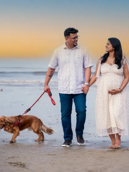 Family isn't just about people; it's about our furry friends too. Including their dog in this beach maternity walk at sunset made the photoshoot even more personal and special.