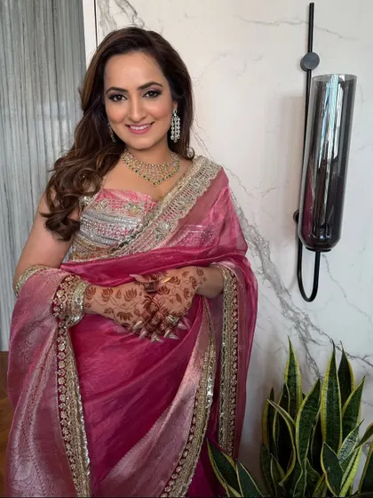 Another shot of the client's elegant party look, where the hairstyle perfectly complements her outfit.