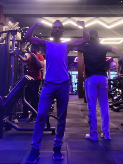 A post-workout pose. The gym is my sanctuary, where hard work translates directly into results.