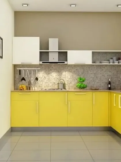 An L-shaped kitchen with bright yellow base cabinets and white uppers. The layout is simple, open, and perfect for a smaller home.
