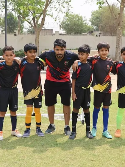 A team photo with their coach during a break in a DFA League match.