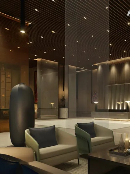 Another view of the One Marina lobby, focusing on the reception area. The clean lines of the desk are contrasted with the rich textures of the wood-paneled ceiling and the polished marble floor.