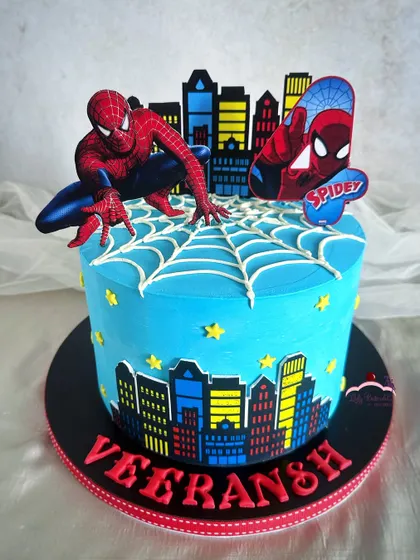 Your friendly neighborhood Spider-Man, swinging into a birthday party! This cake features a city skyline, a piped spiderweb, and Spidey himself ready for action.