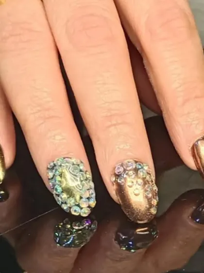A close-up of the dazzling rhinestone-encrusted accent nails.