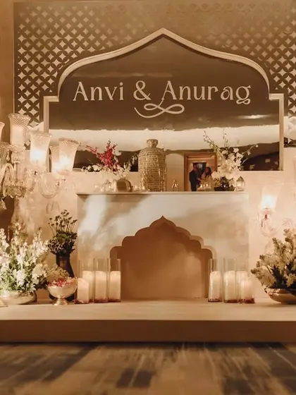 This welcome corner set the tone for modern royalty. We used a custom mirror with the couple's names, traditional candelabras, and lush florals to transport guests into a bygone era of romance.