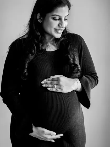 A simple and powerful black and white shot. By removing color, we focus on the emotion and form, creating a truly artistic and timeless keepsake of your pregnancy.