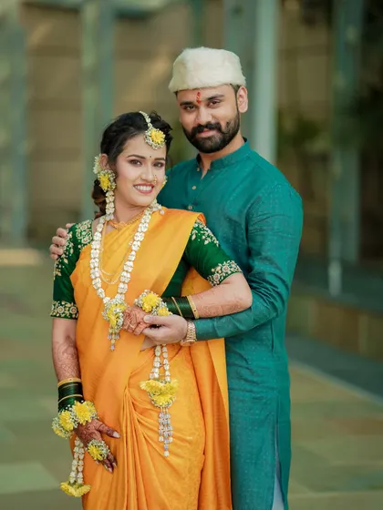 A classic Haldi ceremony portrait. The bride's joyful expression and traditional attire are the focus of this beautiful shot.