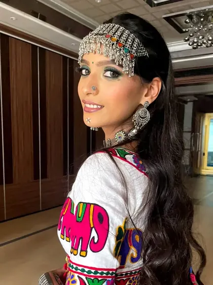 A back profile of the Navratri look, showing the hairstyle and the intricate details of the 'matha patti' (headpiece).