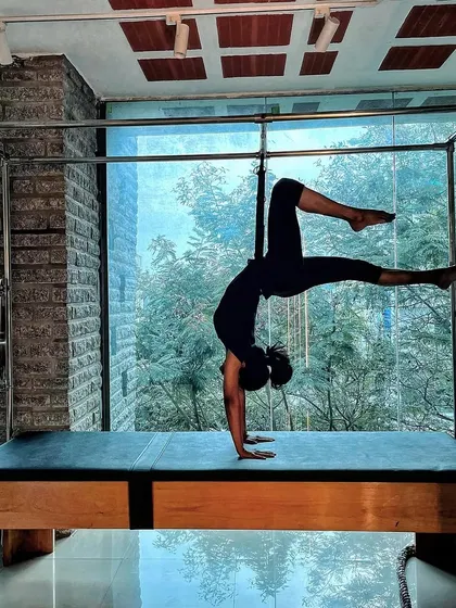 Physical fitness is the definition of wealth. This powerful handstand variation on the Cadillac is an investment in long term health.