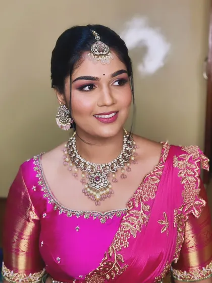 Priyanka's engagement makeup featured a vibrant pink eyeshadow to match her saree, creating a look that is both fun and elegant.