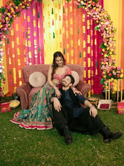 A relaxed and romantic portrait of the couple on their Sangeet stage.