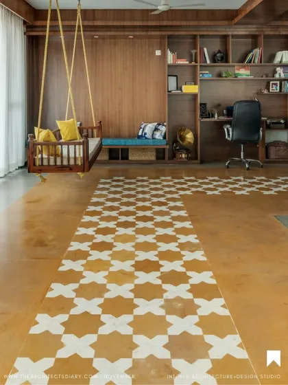 The patterned tilework on the floor acts as a pathway, guiding movement through the open space while adding a distinct graphic and traditional element to the room's design.