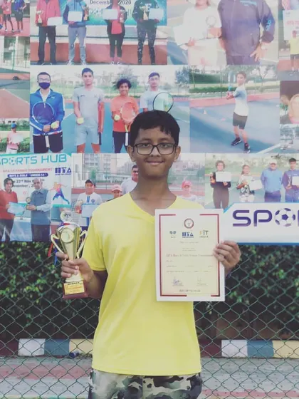Riddhiman Ojha proudly displays his trophy and certificate after winning the Doubles title at a TS-7 tournament in Gurgaon for the Under-14 category.