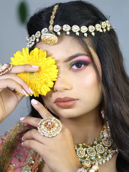A playful and creative pose that adds personality to the bridal portfolio.