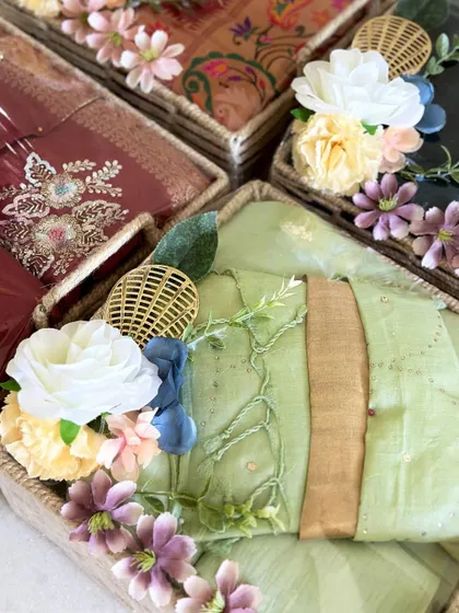 A detailed shot of the floral arrangements on our trousseau baskets. We use a mix of flowers and textures to create beautiful, bespoke decorations.