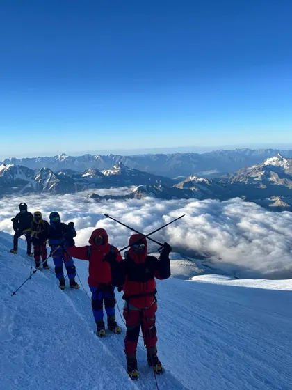 A moment of pure triumph on Mount Elbrus, the highest peak in Europe. Standing above a sea of clouds, our climbers soak in a view that few will ever witness. This is the reward for every hard step taken on the journey to one of the Seven Summits.