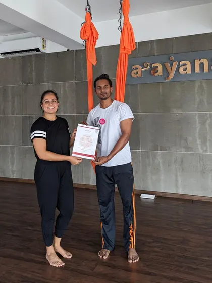 Our instructor, Mrinali, congratulates a new teacher on completing the course.