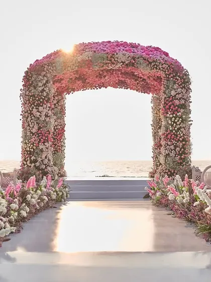 This is what it looks like when your dream of a beach wedding comes true. I designed this floral mandap in Goa to feel like a part of the sunset, creating a breathtaking frame for the couple's "I do" moment against the ocean.