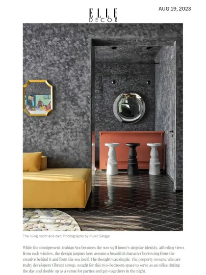 A beautiful shot of the bar area from the Elle Decor feature, showcasing the dark, textured walls and bold, colorful furniture.